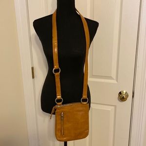 HOBO Tan leather crossbody bag.